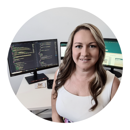 Katarina Farkas sitting in front of computer monitor showing code